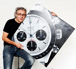 Didier Vallé met een schilderij van een Rolex Daytona
